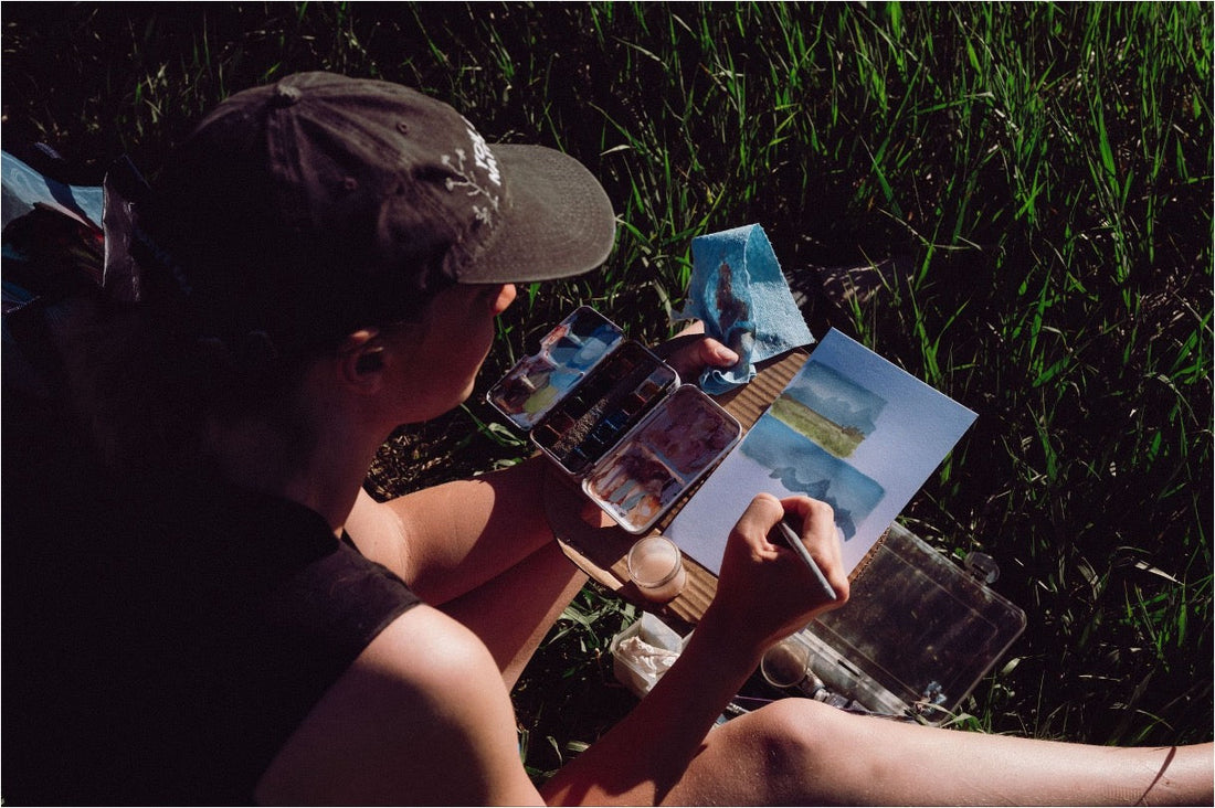 Woman trying out plein air painting in the outdoors