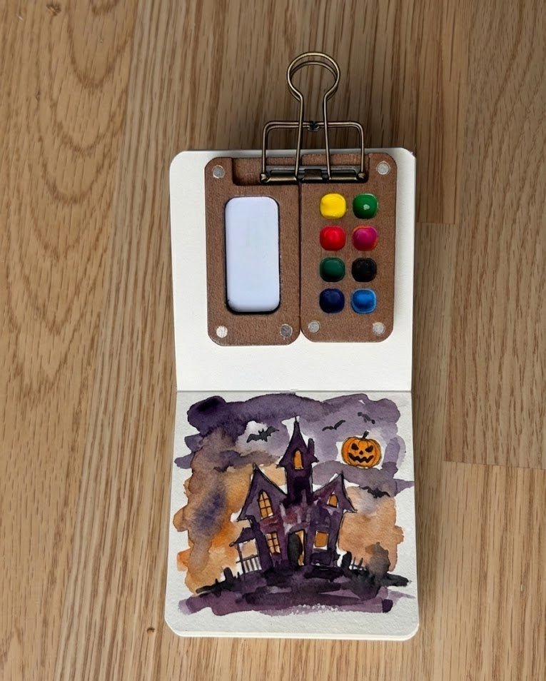Tobio’s Kits halloween watercolor paintings, painted in a small watercolor sketchbook with soft washes and simple details.