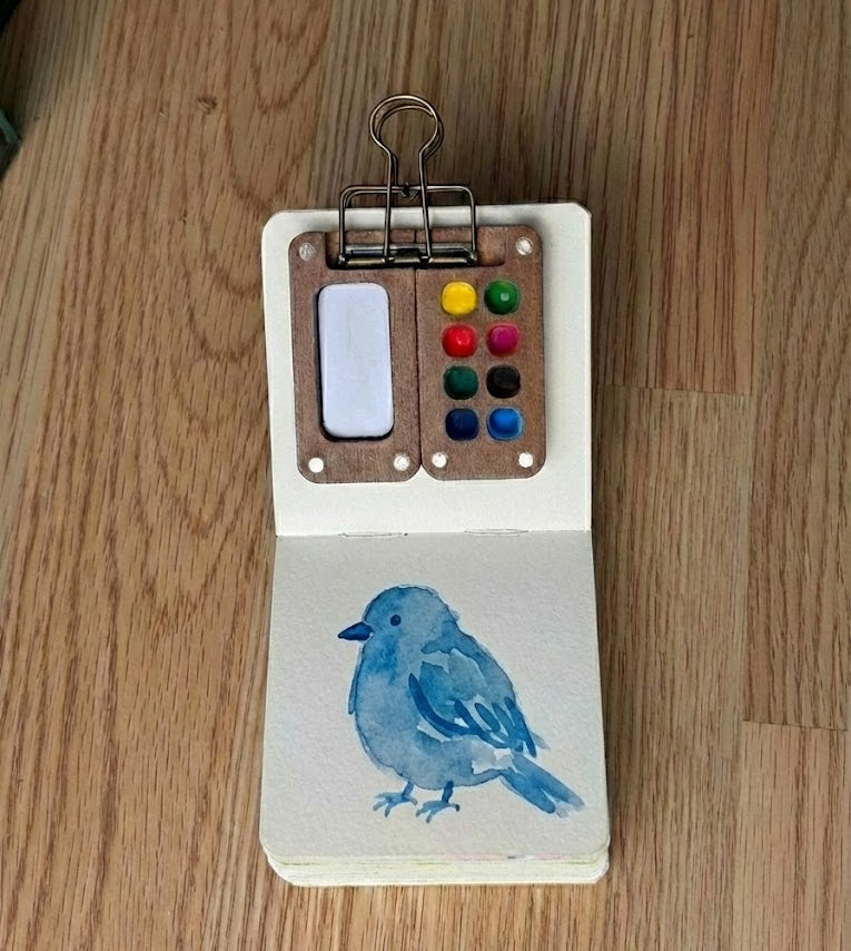 Watercolor painting of a blue bird