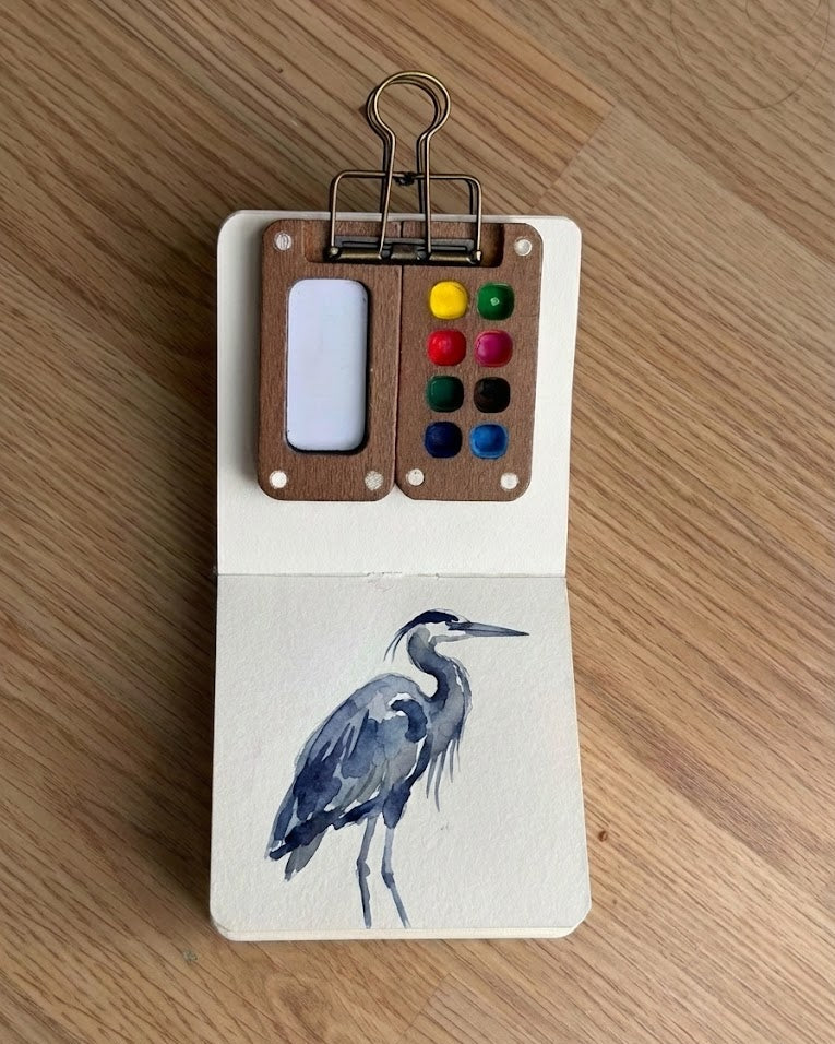 Tobio’s Kits blue heron watercolor painting, painted in a small watercolor sketchbook with soft washes and simple details.