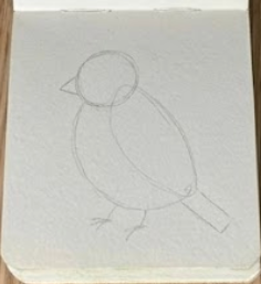 Pencil sketch outline for a loose bluebird watercolor painting in a small open sketchbook with a mini wooden palette attached.