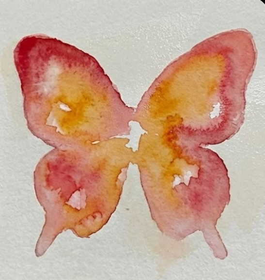 Applying a wet-on-wet yellow and red wash to wings in a butterfly watercolor painting.