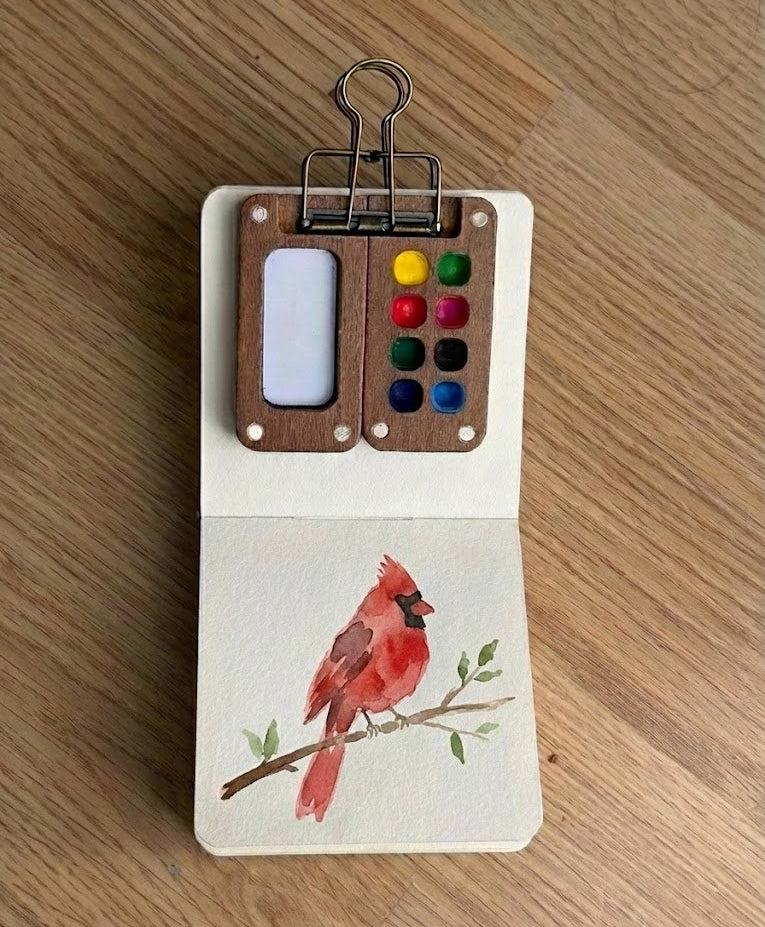 A watercolor painting of a cardinal