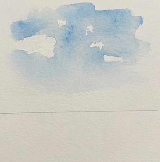 Step 1 of a cityscape watercolor painting showing a loose blue sky wash and horizon line.
