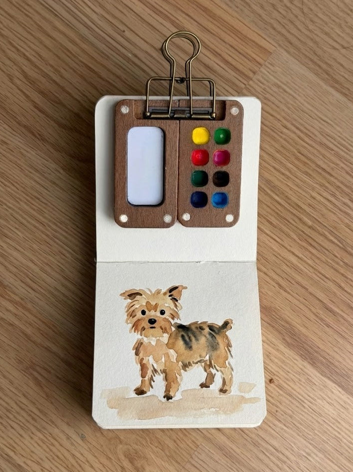 Tobio’s Kits dog watercolor painting, painted in a small watercolor sketchbook with soft washes and simple details.