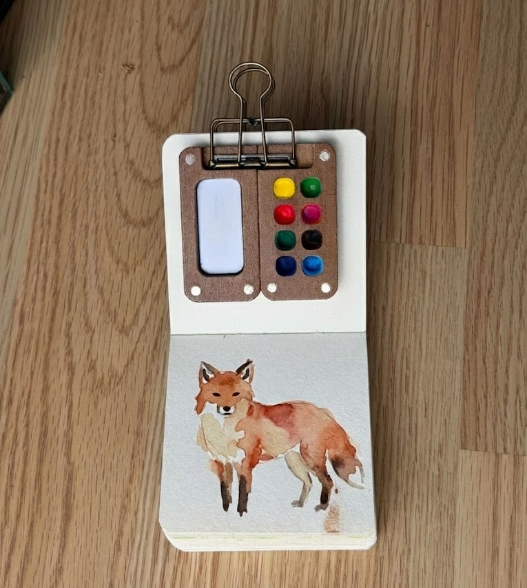 A watercolor painting of a fox