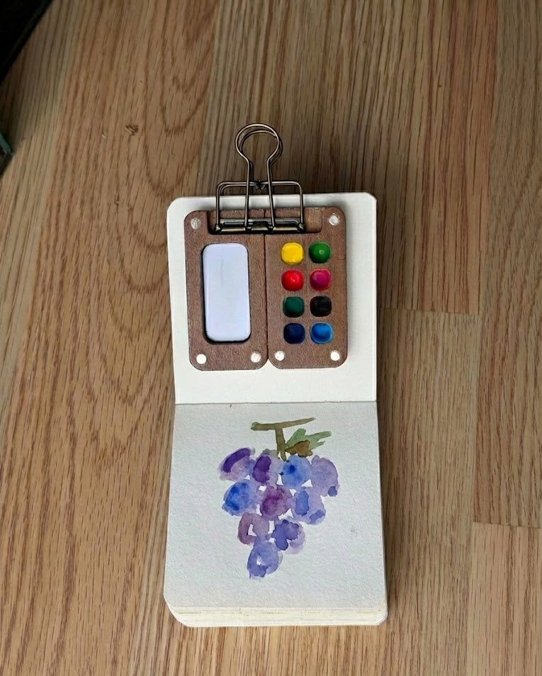 Tobio’s Kits fruit watercolor painting, painted in a small watercolor sketchbook with soft washes and simple details.