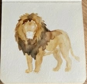 Adding wet-on-wet dark brown details to the mane in step three of an in-progress lion watercolor painting.