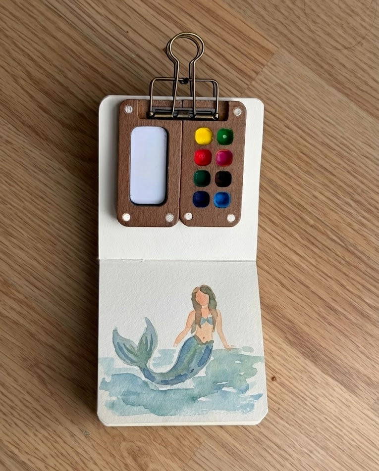 Tobio’s Kits mermaid watercolor painting, painted in a small watercolor sketchbook with soft washes.