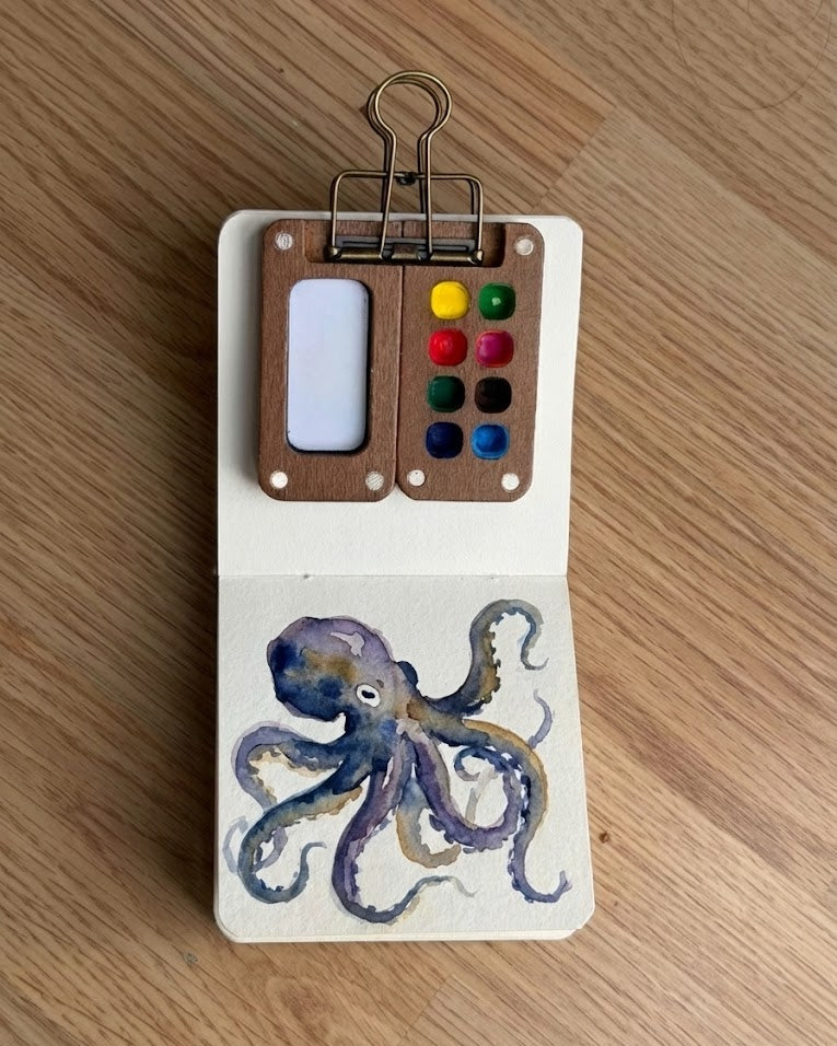 Tobio’s Kits octopus watercolor painting, painted in a small watercolor sketchbook with soft washes and simple details.