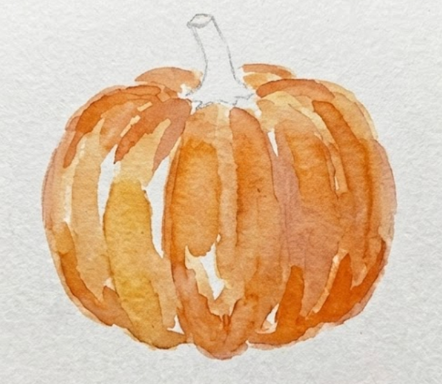 Step 2 of the pumpkin watercolor painting process featuring a loose wash of orange paint with unpainted white gaps left for highlights.