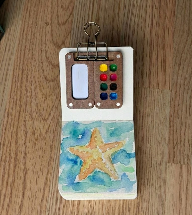 A watercolor painting of a starfish