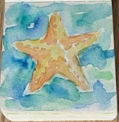 The final completed starfish watercolor painting featuring burnt sienna shadows and dotted texture details added over the dry yellow wash.