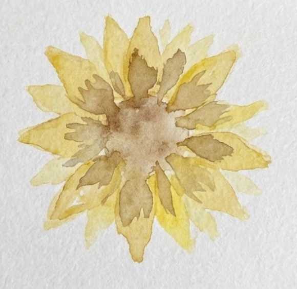 Step 2: A progressive step in a sunflower watercolor painting tutorial, adding a darker yellow-brown petal layer and an initial light brown watercolor wash in the flower's center.