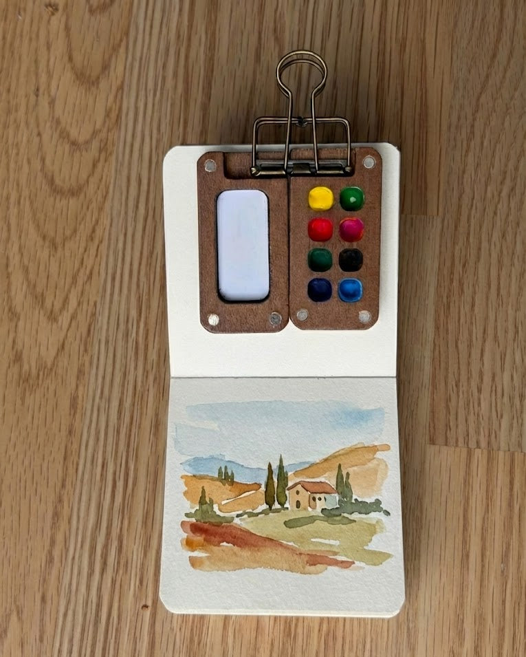 Tobio’s Kits tuscany watercolor paintings, painted in a small watercolor sketchbook with soft washes and simple details.