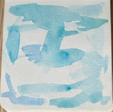 First step of an underwater watercolor painting, showing a patchy blue background wash.