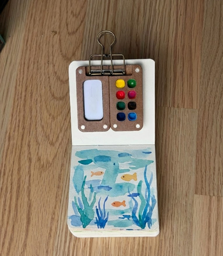 Underwater watercolor painting of fish and seaweed 