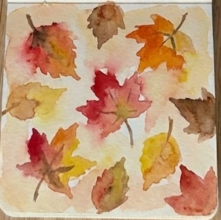 Fine, dark brown watercolor stems and central veins are added with a detail brush, completing the loose sketchbook-style watercolor painting of autumn leaves.