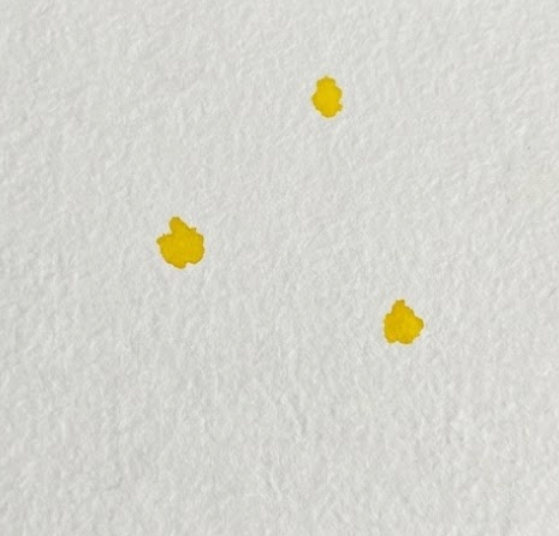 Step 1 of watercolor pansy tutorial showing three yellow paint dabs for flower centers on textured paper.