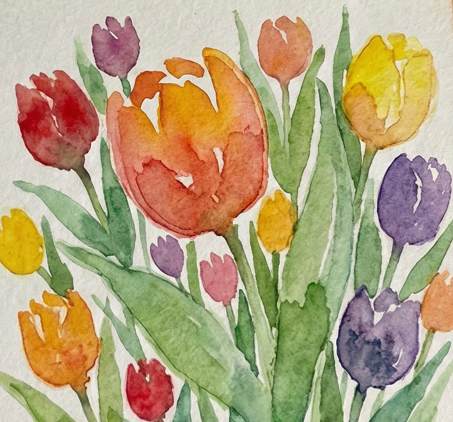 Step 3 adding the greenery with sap green watercolor, painting stems and wide leaves in the negative space between the flowers to define their shapes.