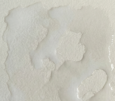 Watercolor paper is prepared with clean water, applied in irregular patches to create wet areas while leaving random shapes of dry white paper for nebula clouds.