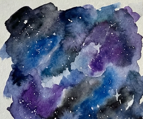 The final galaxy painting with white gouache splattered and hand-drawn stars added over the dry watercolor layers to complete the cosmic effect.