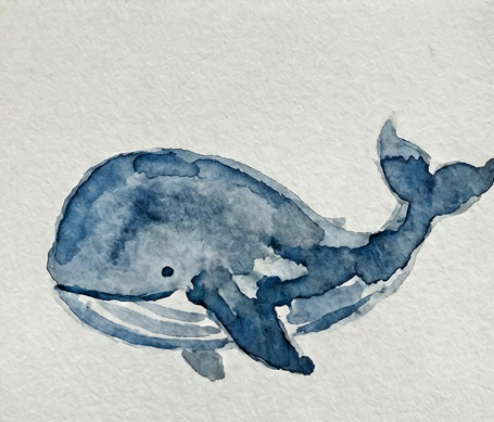 Completed, detailed expressive whale watercolor painting study with a defined eye, mouth, and characteristic rich blue-black tones.